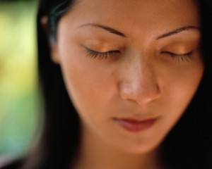 Woman closing her eyes, thinking about counseling for adults